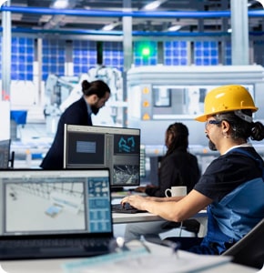 Engineer working with robots in an advanced automation laboratory.