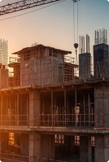 Building under construction in Mobile, Alabama at sunset.